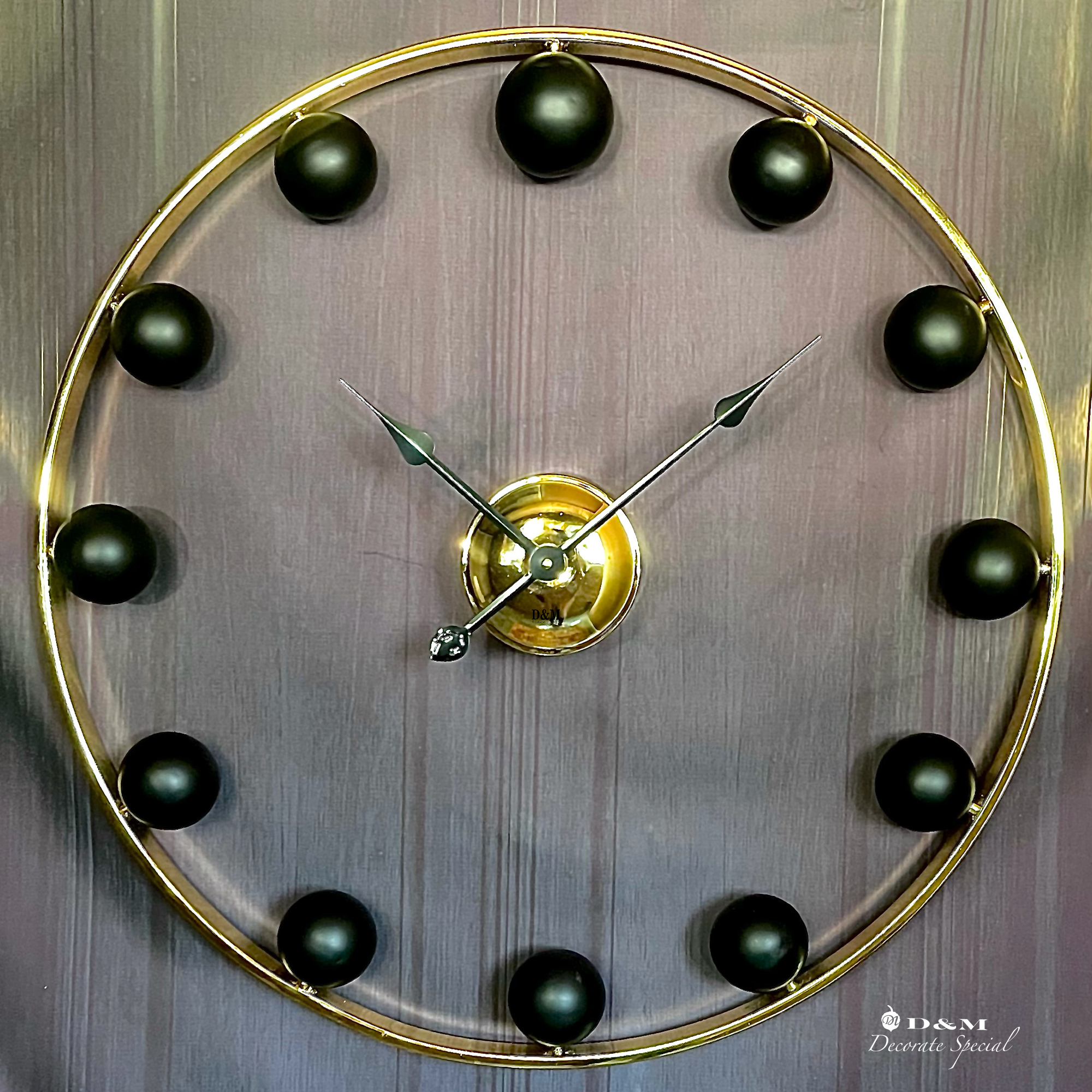 ساعت دیواری گویال مشکی گلد